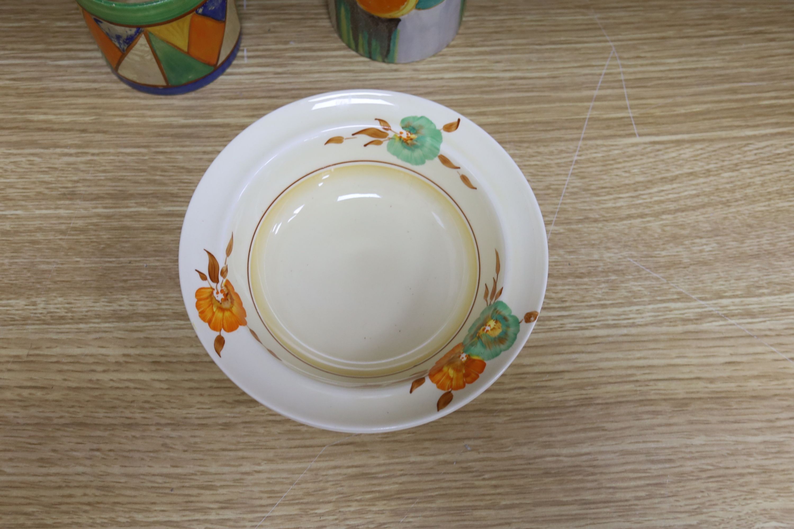 A quantity of Clarice Cliff pottery, Including Crocus pattern tea wares, two preserve jars missing Lids, a plate and three bowls